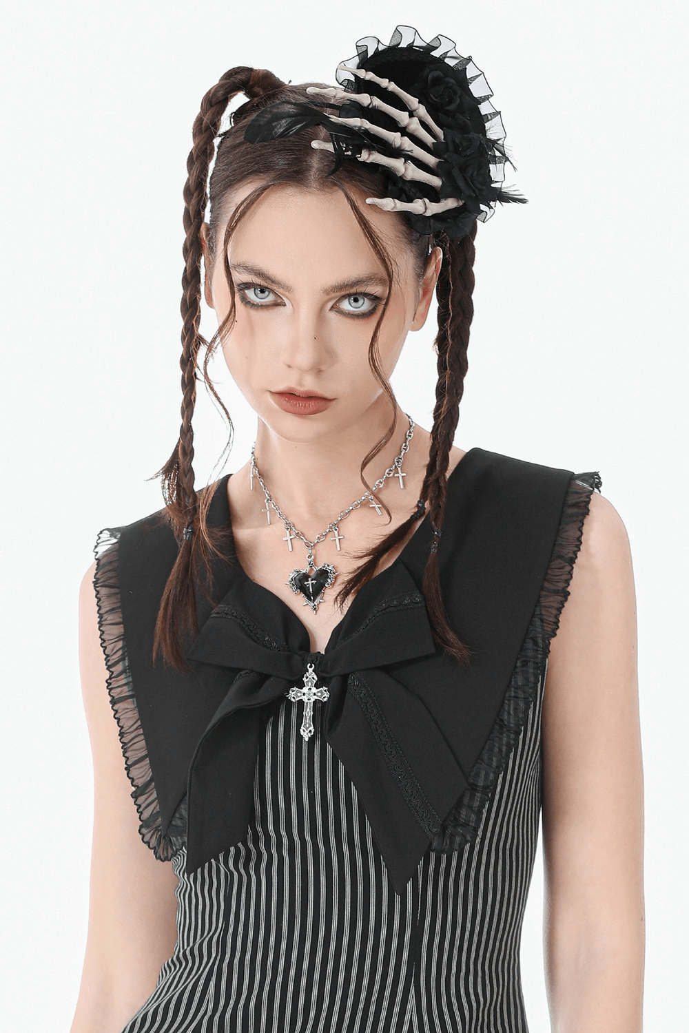 Goth Cross Charm Chain Necklace with Black Heart Pendant worn by model in gothic attire with skeleton hair accessory.