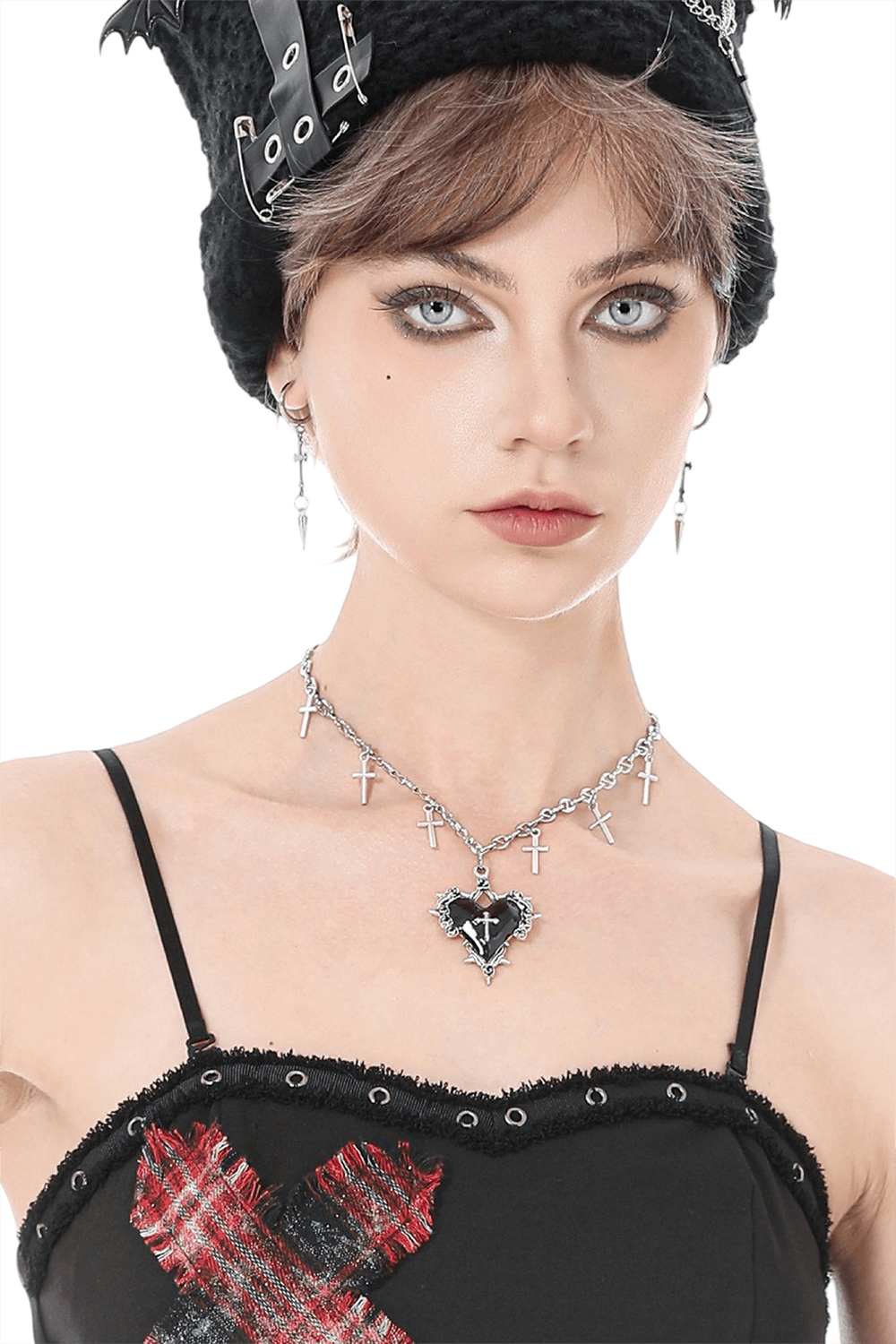 Goth Cross Charm Chain Necklace with Black Heart Pendant worn by a model with edgy fashion style and accessories.