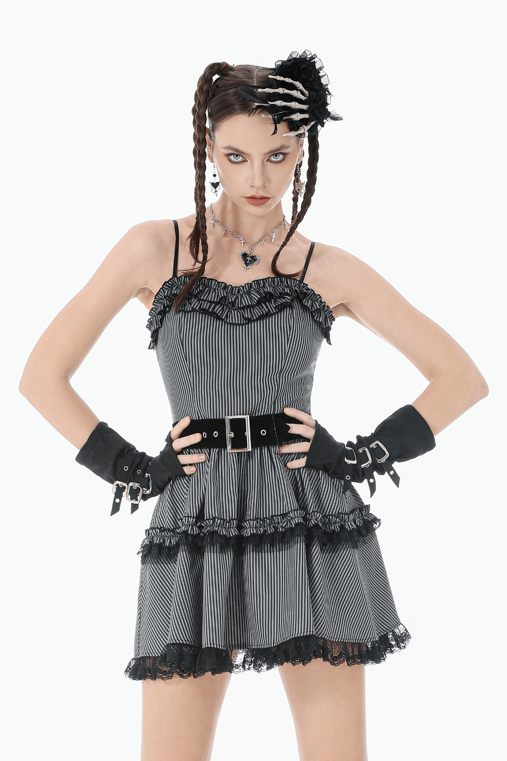 Goth Cross Charm Chain Necklace with Black Heart Pendant featured with a black and white striped dress and punk accessories.