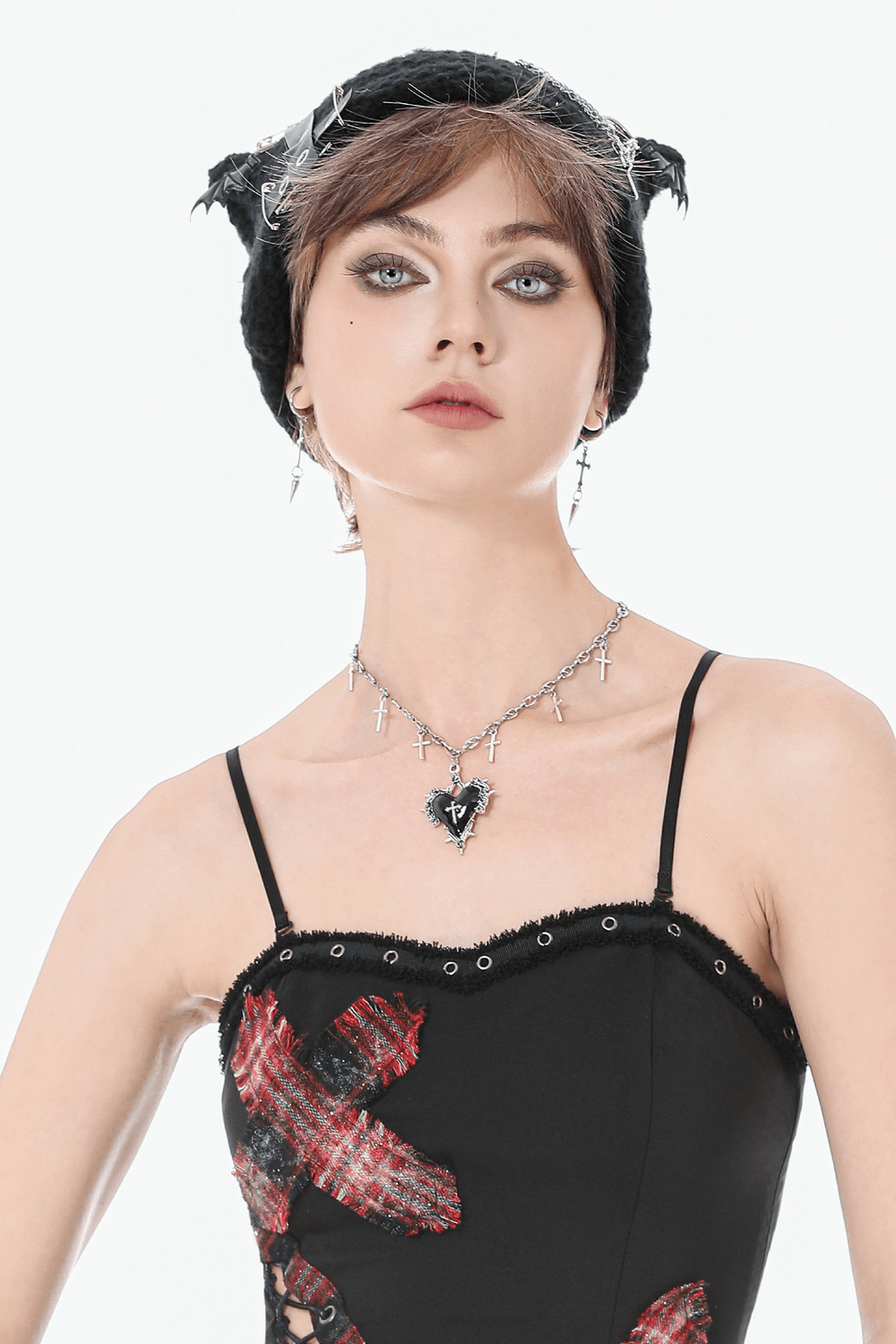 Model wearing Goth Cross Charm Chain Necklace with Black Heart Pendant, showcasing dark romance style with a black heart and cross charms.