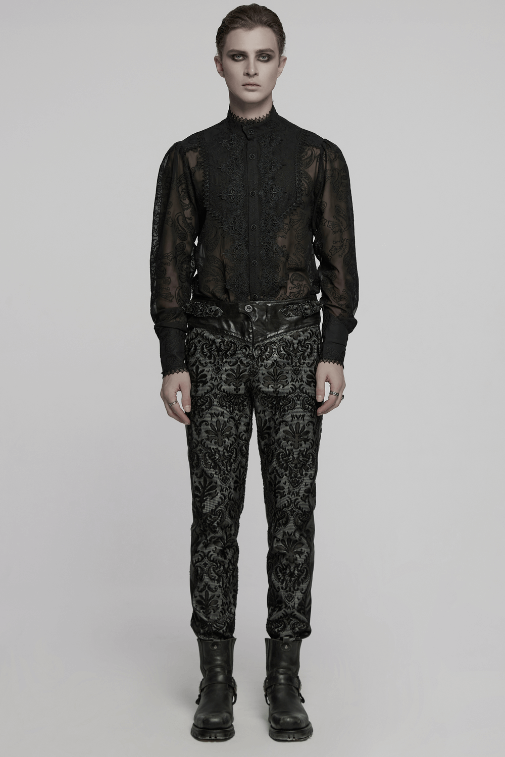 Goth embroidered lace pants with adjustable waist strap, styled with a sheer black shirt for a chic gothic look.