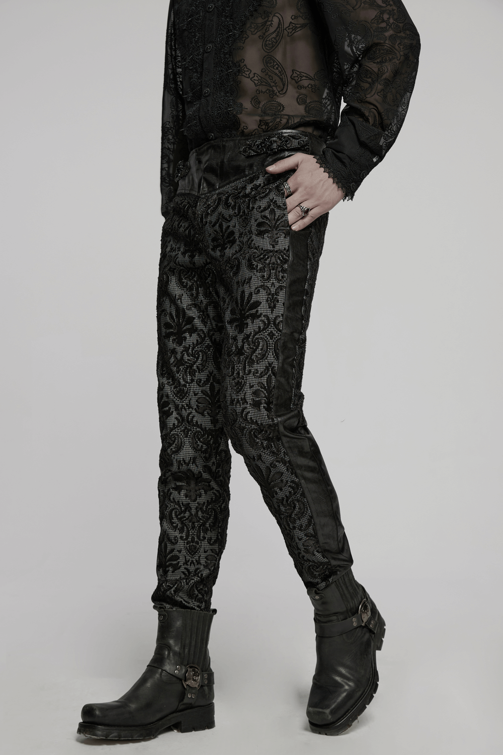 Goth embroidered lace pants with adjustable waist strap, stylish silhouette, and back pockets in black fabric.