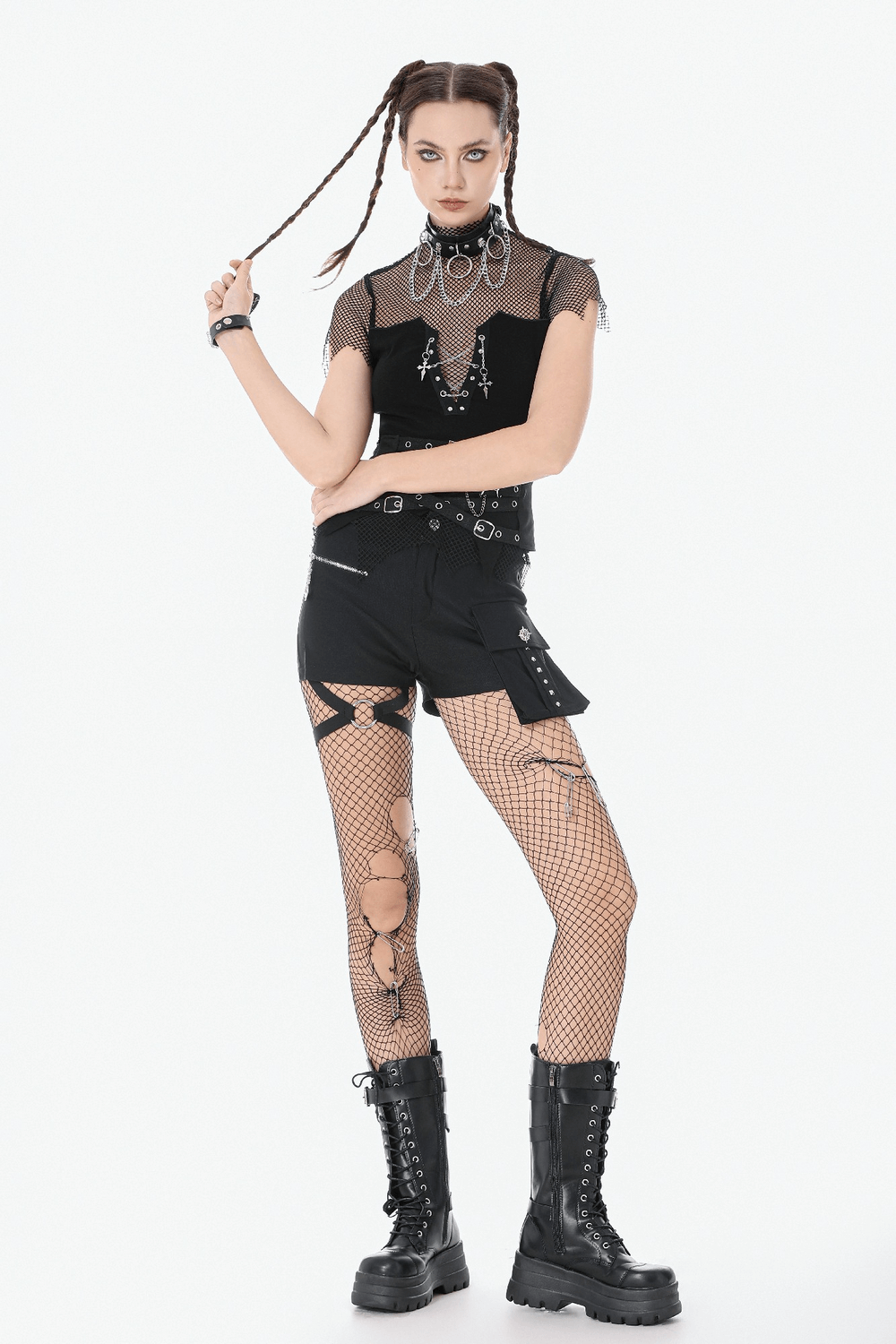 Goth Fishnet Lace-Up Cami Top with Cross Charms worn with shorts and fishnet tights, showcasing punk-inspired fashion.