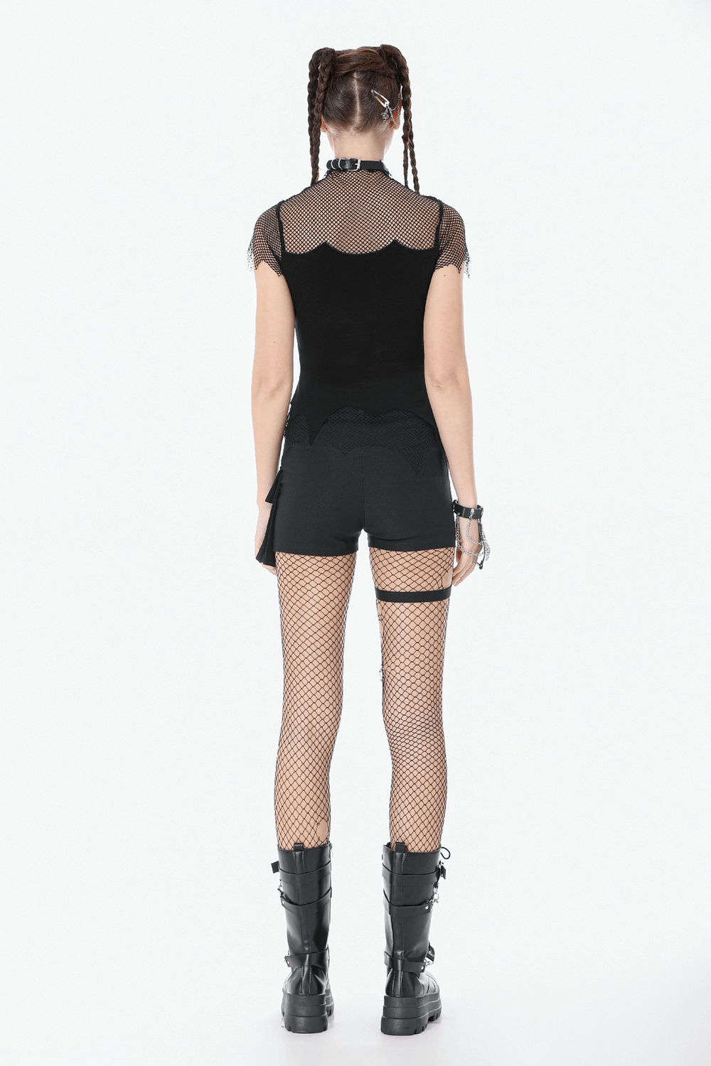 Back view of Goth Fishnet Lace-Up Cami Top with Cross Charms paired with fishnet tights and shorts.