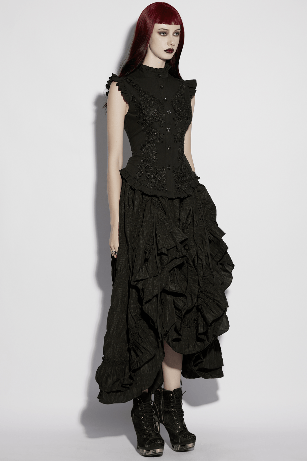 Alt Tag: Goth Flying Shoulder Shirt with Lace and Corset Back on model, black gothic lace ruffle top with stand collar, corset back vibe