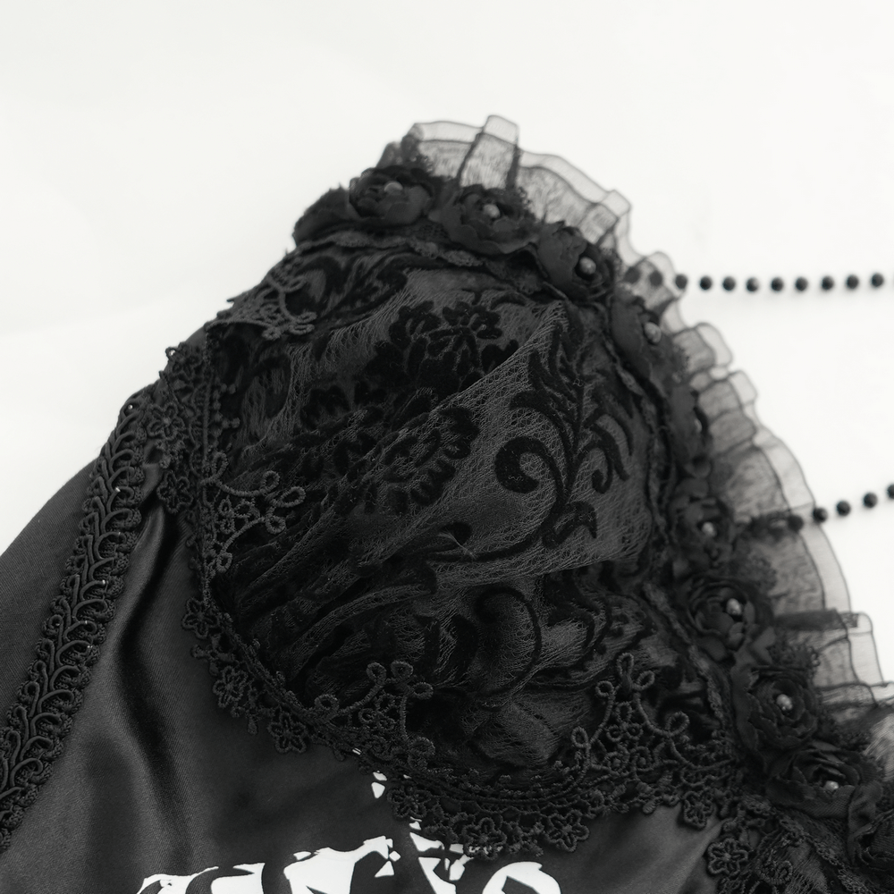Close-up of the lace overlay and gothic neckpiece on a halter dress, showcasing intricate details and dark elegance.