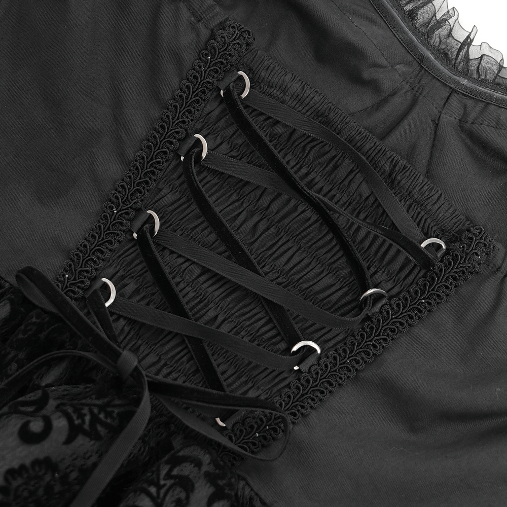 Close-up of the lace-up corset detail on the goth halter dress with intricate black lace and tulle elements.