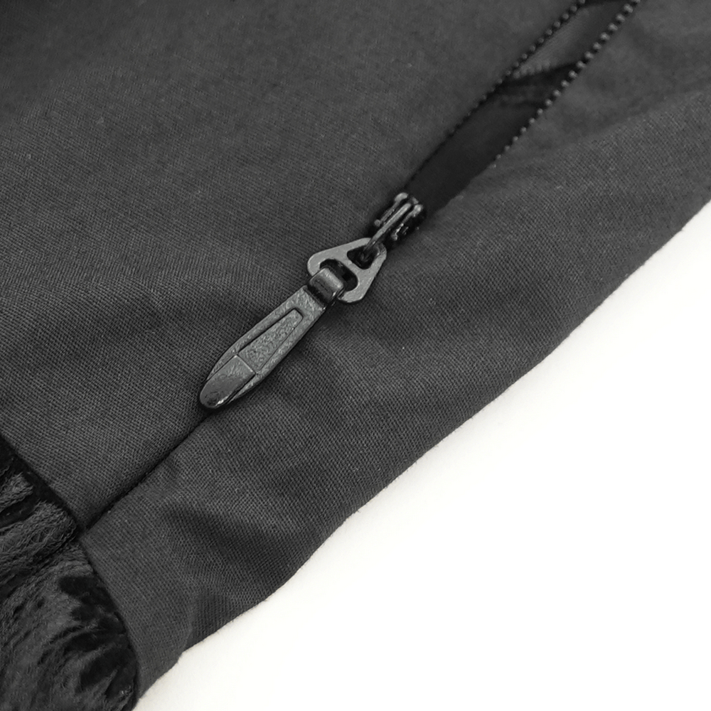 Close-up of a black zipper on a gothic halter dress showcasing sleek design details.