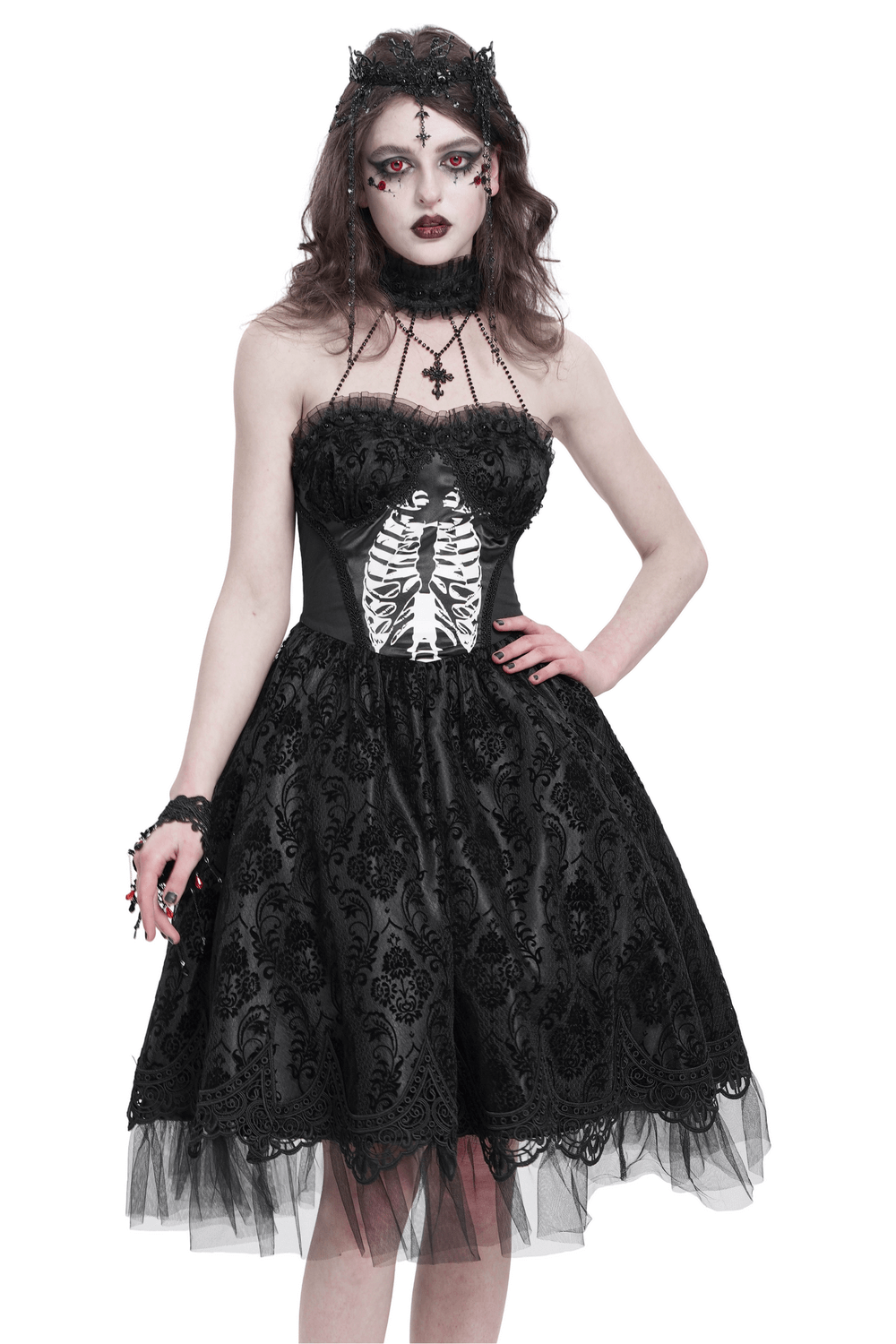 Gothic halter dress with lace overlay, tulle skirt, and ribcage print, perfect for alternative fashion lovers.