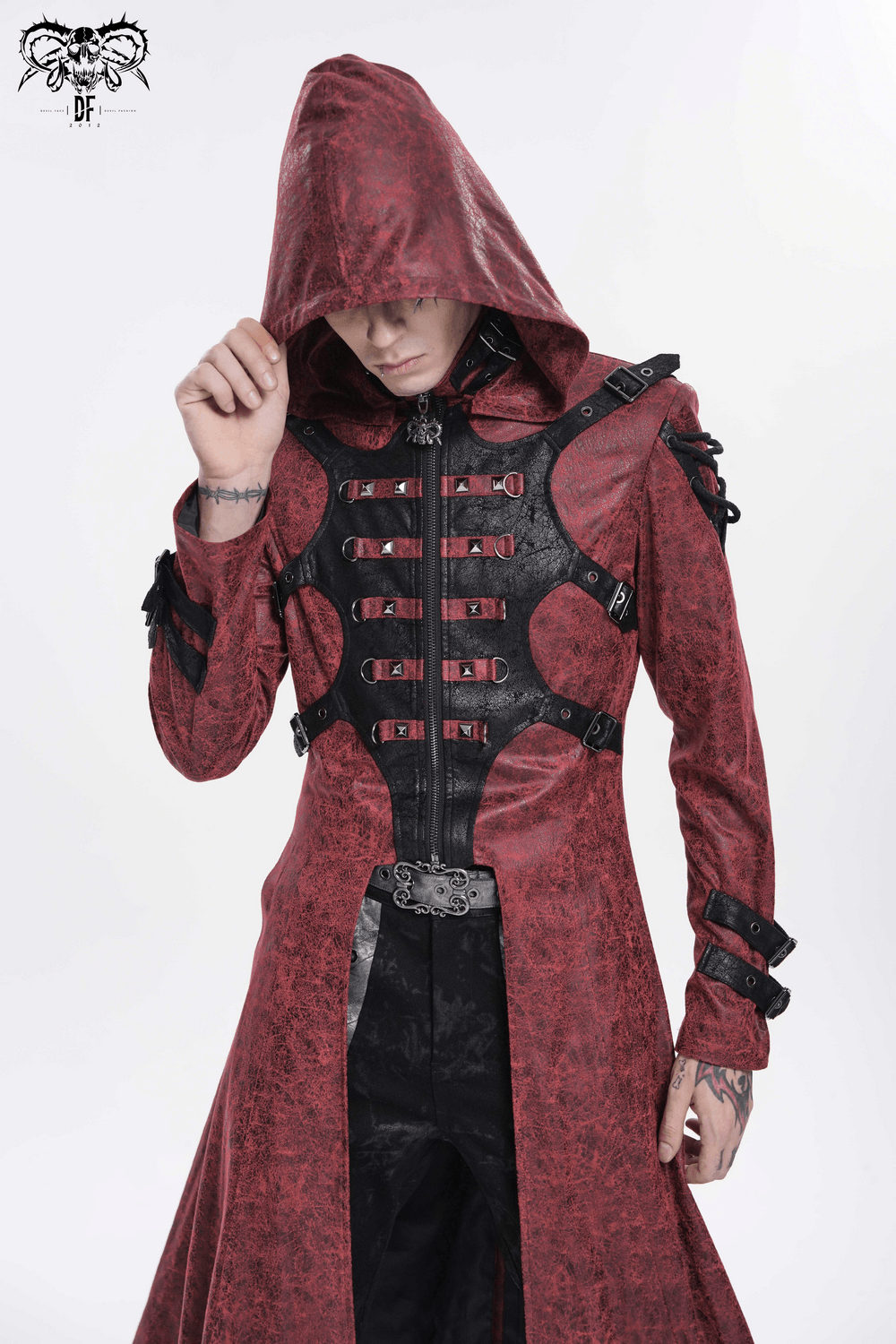 Goth Hooded Long Coat with Buckle Harness Details for Men modeled by a man in a dramatic pose