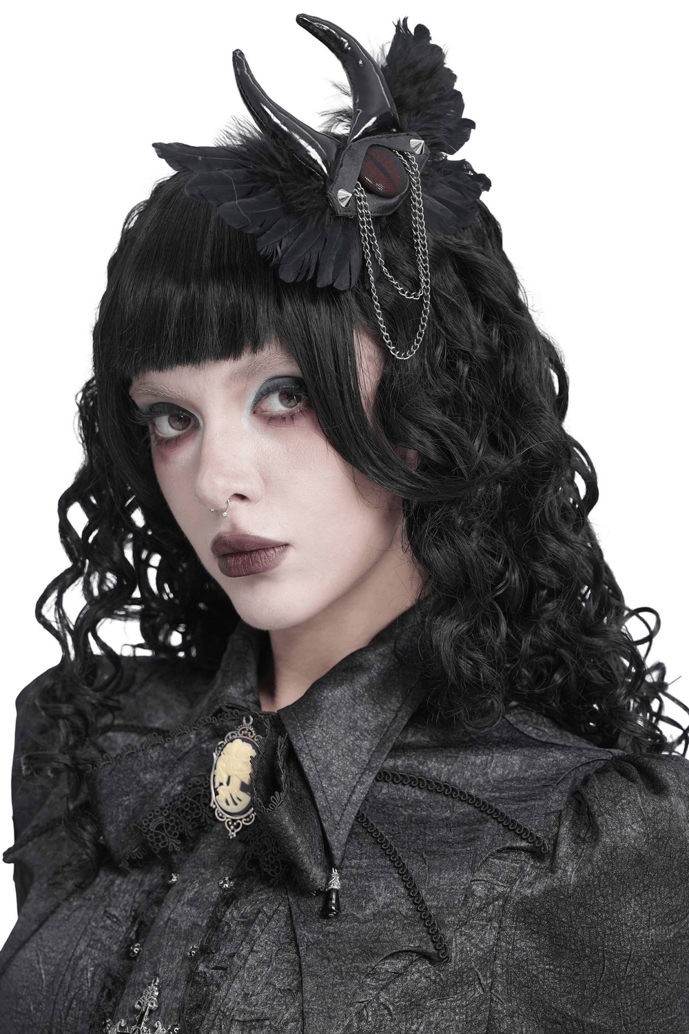 Goth Horn and Feather Brooch with Chain Accents worn by model, showcasing dark fantasy style and gothic fashion.