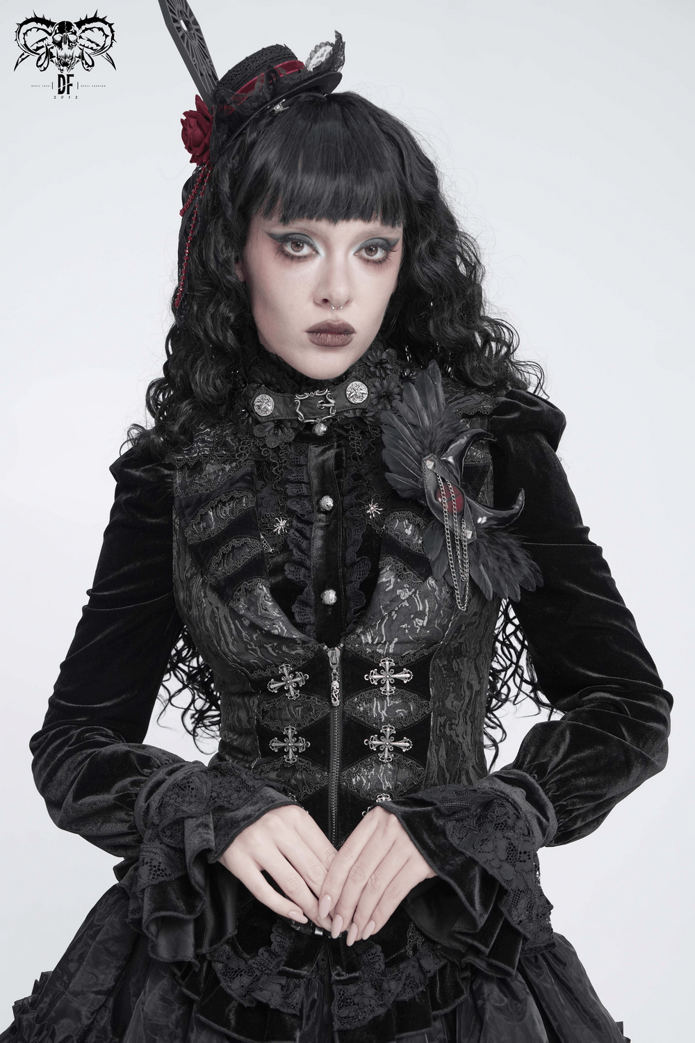 Goth Horn and Feather Brooch with Chain Accents showcased on a model in gothic attire.