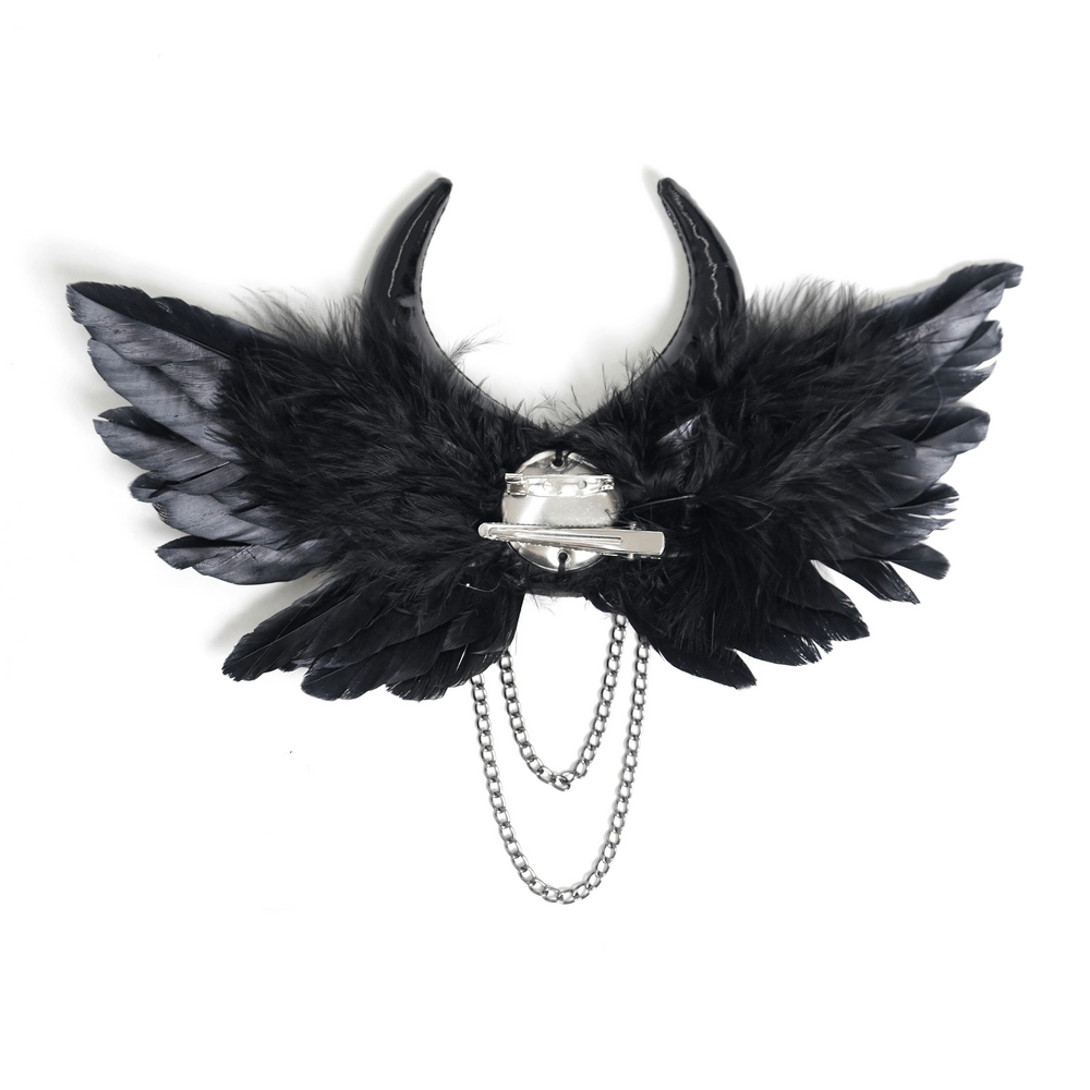 Goth Horn and Feather Brooch with Chain Accents featuring dramatic raven feathers and curved demon horns.