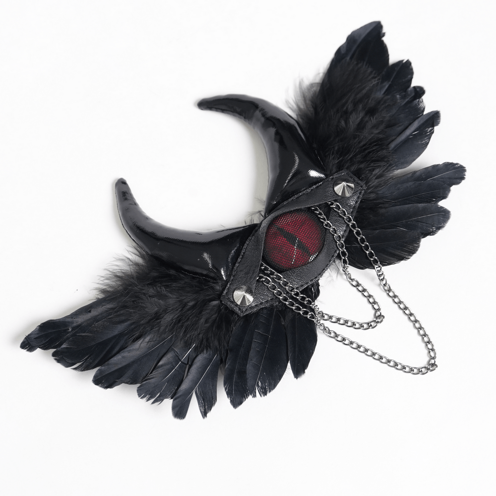 Goth Horn and Feather Brooch with Chain Accents featuring black feathers and curved demon horns.