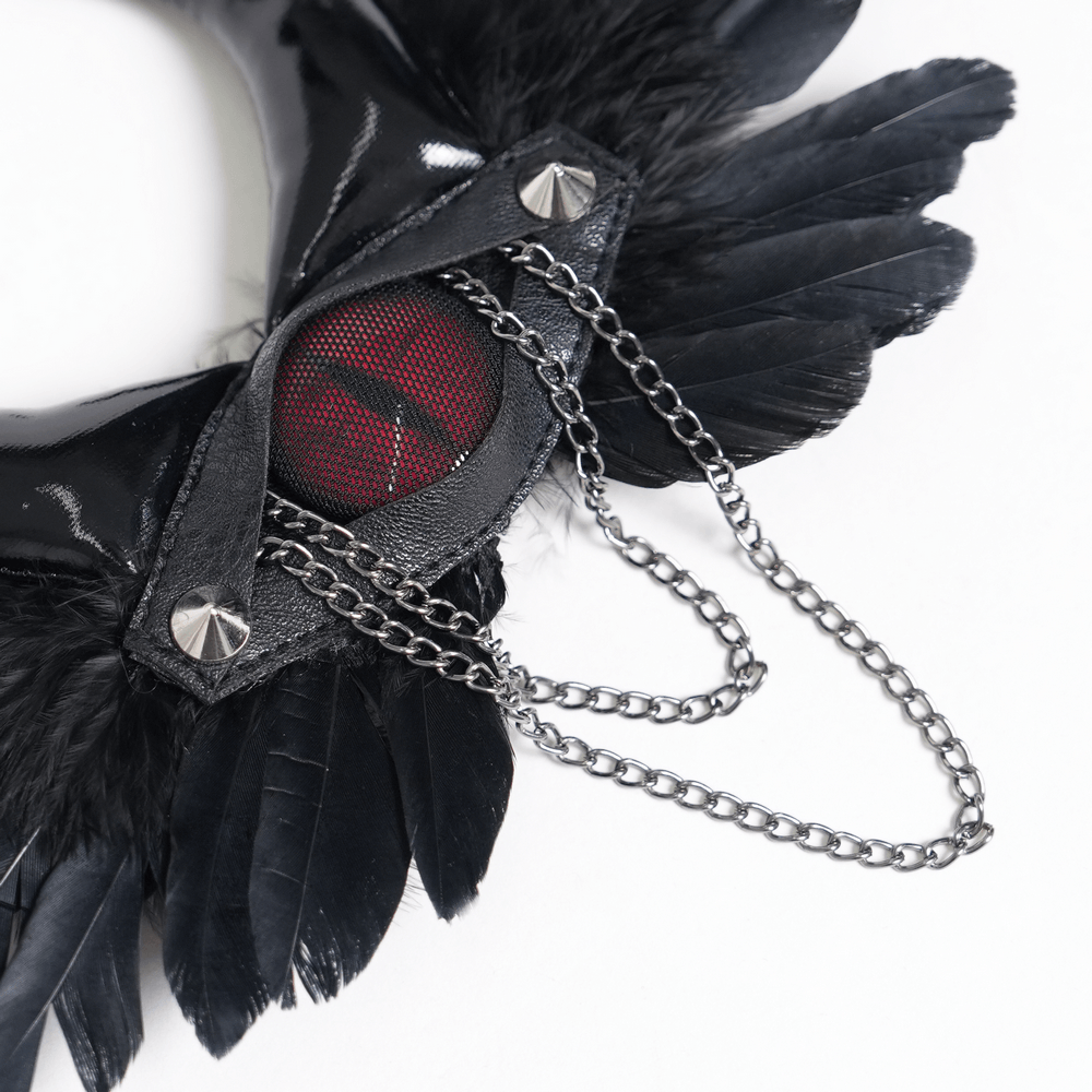 Goth Horn and Feather Brooch with Chain Accents featuring black feathers, demon horns, and red center.