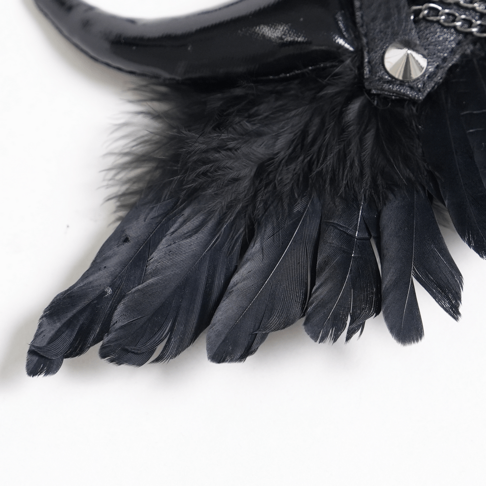 Goth Horn and Feather Brooch with Chain Accents featuring dramatic black feathers and curved horns.