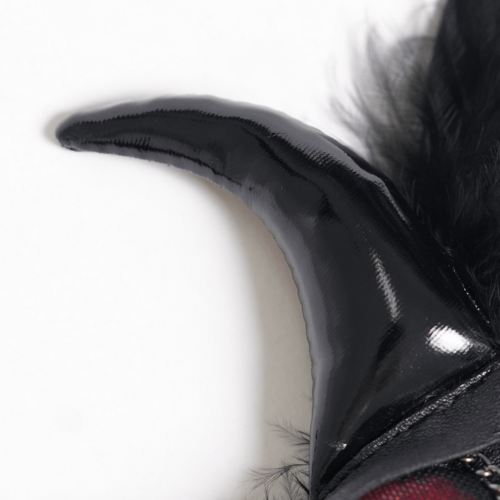 Goth Horn and Feather Brooch with Chain Accents close-up, showcasing black demon horn detail.
