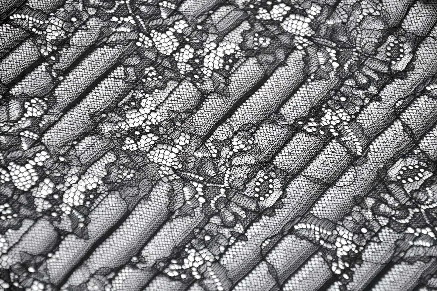 Goth Lace Bolero Shrug with Dramatic Long Bell Sleeves detailed fabric showcasing sheer floral lace and striped panels.