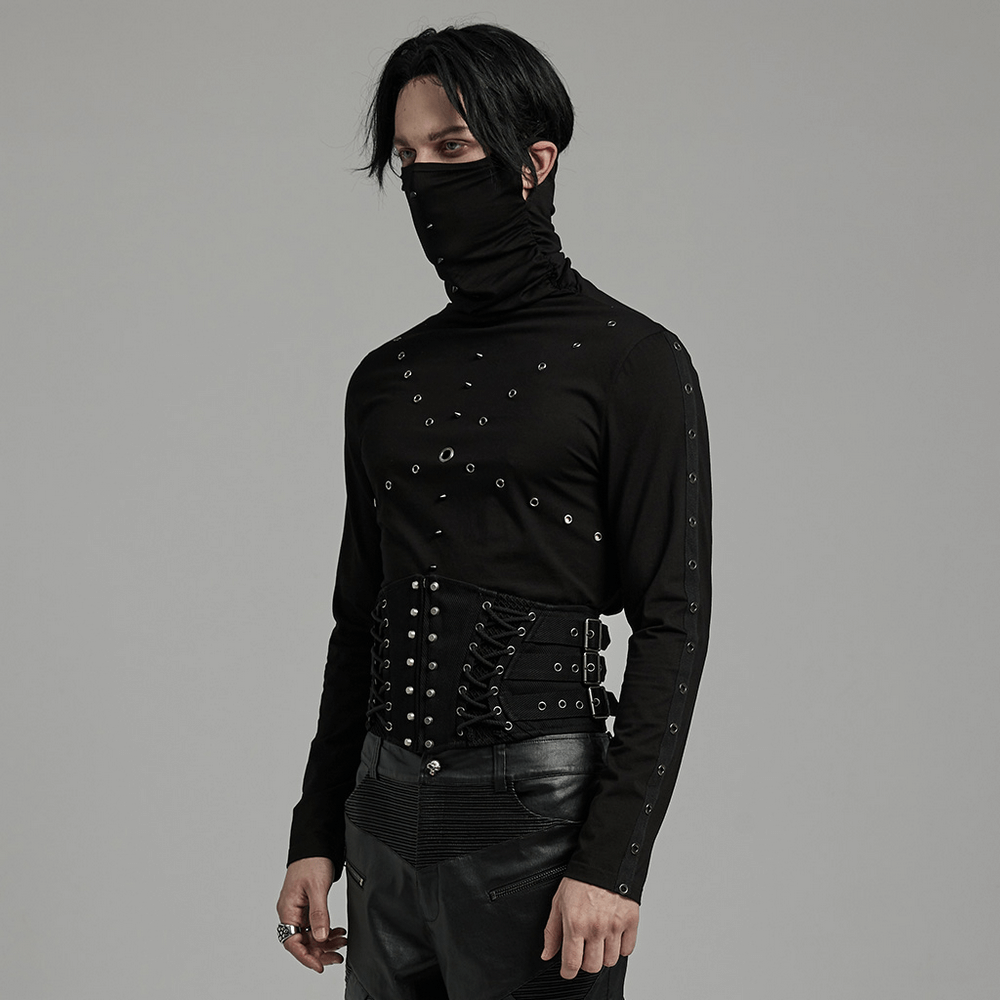 Punk male model in black lace-up corset belt and matching clothing, showcasing a stylish gothic look.
