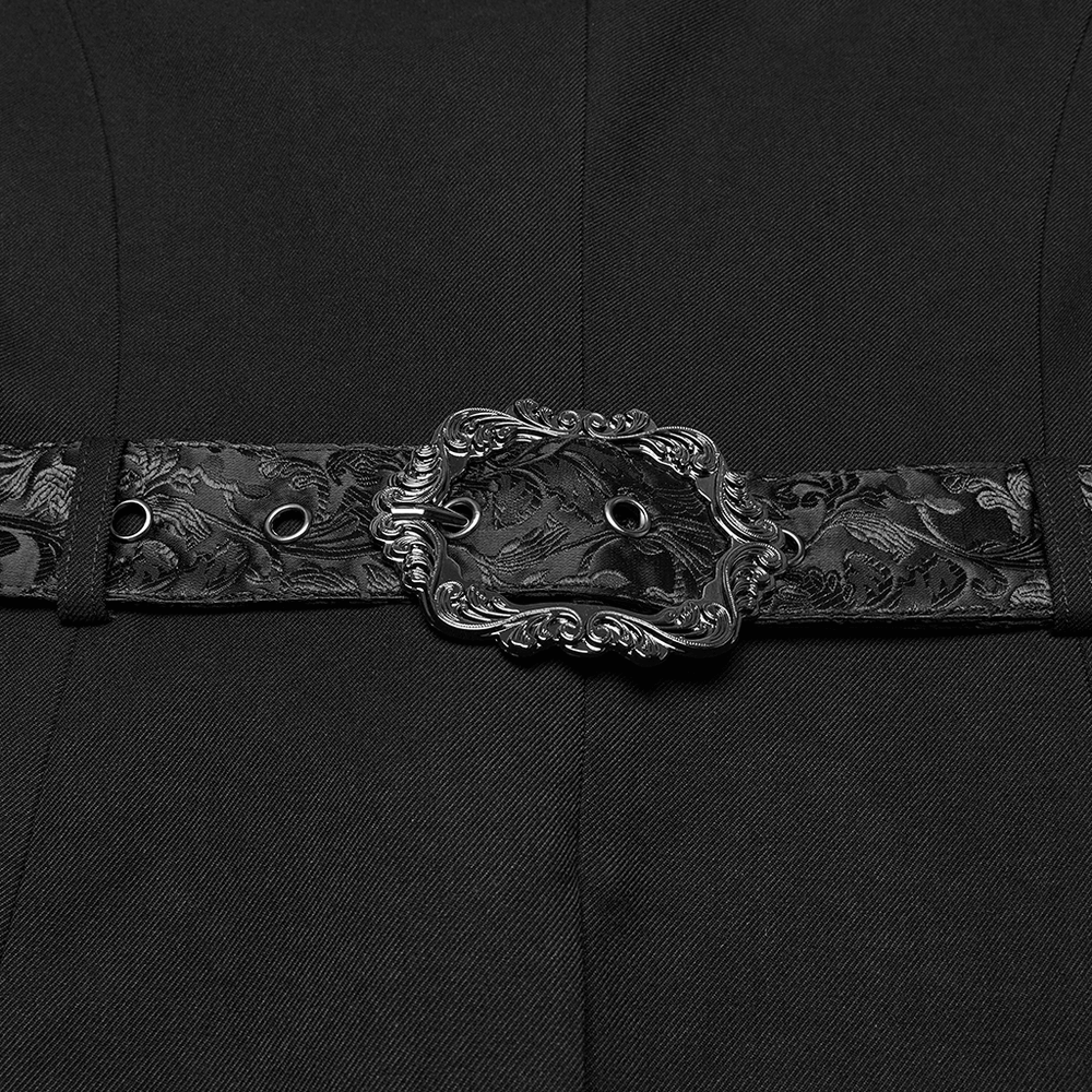 Goth luxury gentleman's tuxedo detail featuring an ornate jacquard design belt buckle.