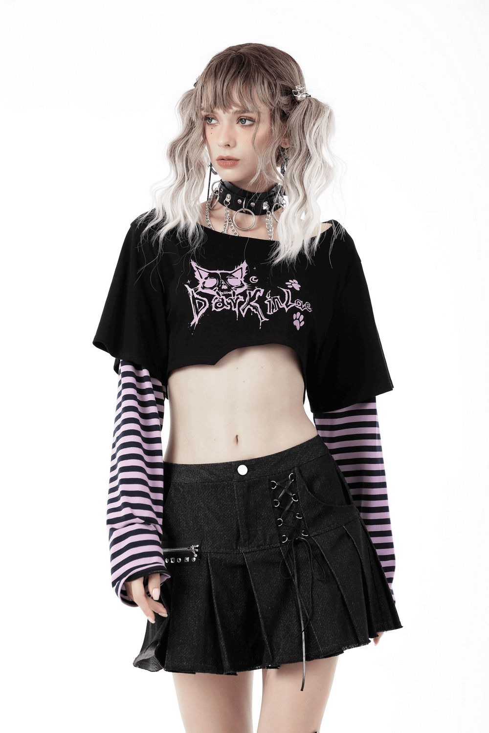 Goth punk crop top with Cheshire Cat graphic and striped long sleeves, styled with a black skirt and choker.