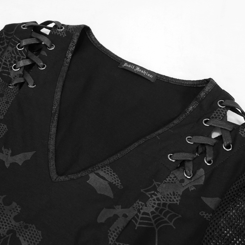 Close-up of black goth dress with V-neck, lace-up details, and spooky bat prints by Devil Fashion.
