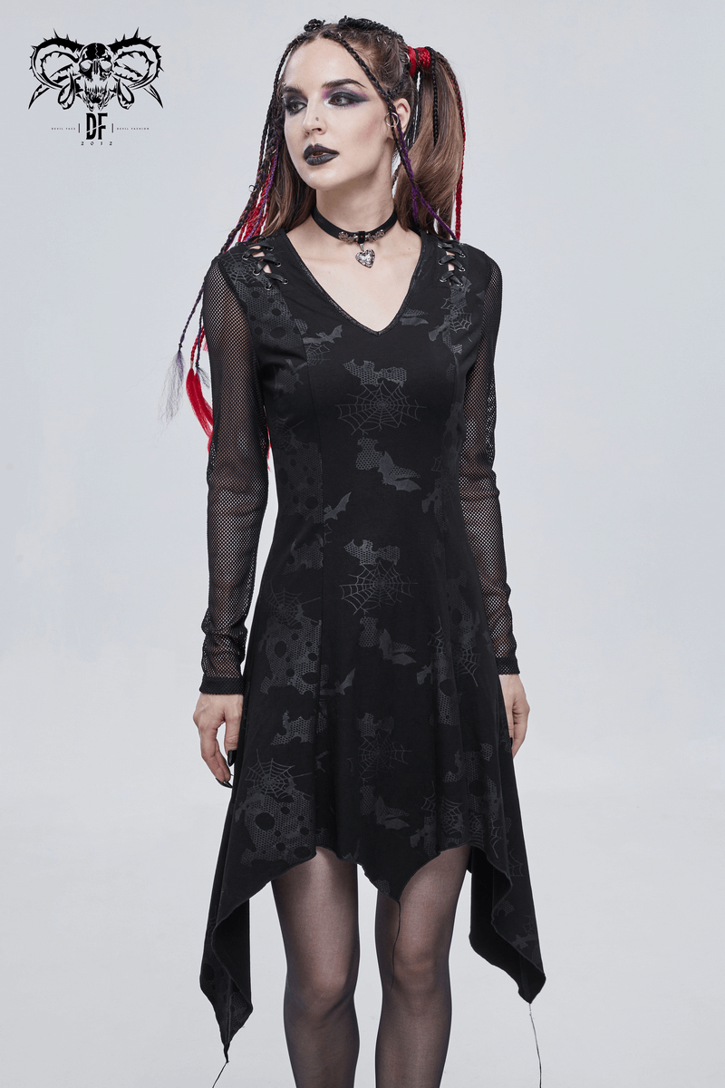 Model wearing a black goth punk dress with V-neck and asymmetrical hem, showcasing elegant gothic style.