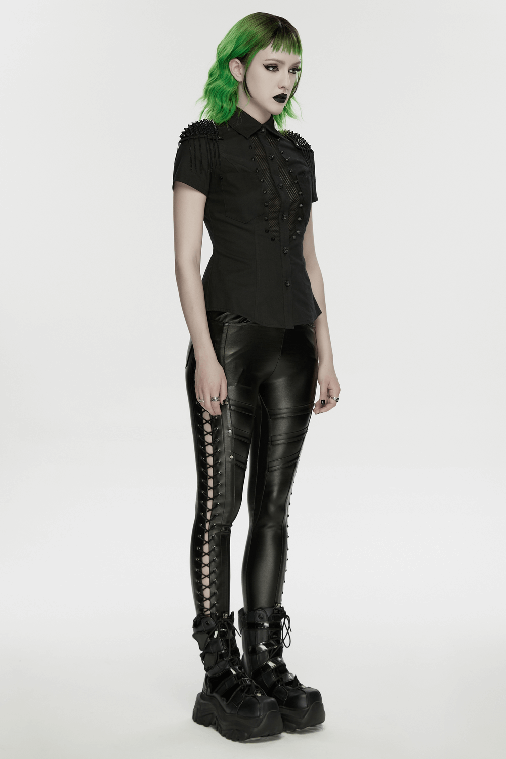 Goth Punk Mesh Panel Spiked Shoulder Button Shirt paired with black leather pants and chunky boots, perfect for edgy style.