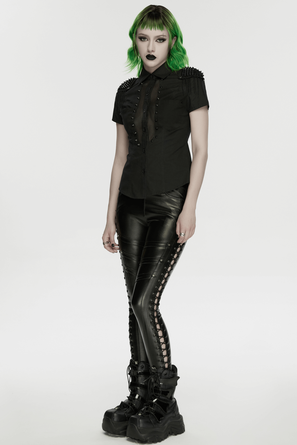Goth Punk Mesh Panel Spiked Shoulder Button Shirt worn with black leather pants and chunky boots, showcasing punk fashion.