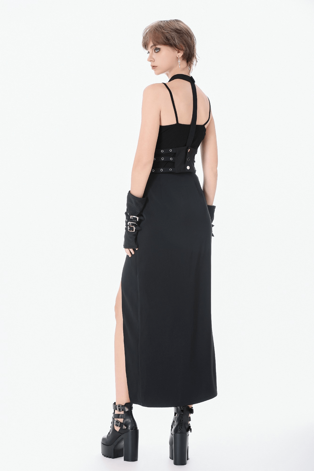 Goth Punk Strappy Chest Harness with Metal Eyelets worn over a sleek long black dress, showcasing its stylish back design.
