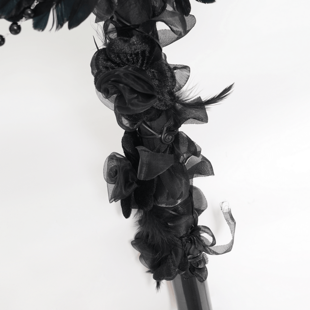 Alt Tag: Goth Raven Cross Staff with Roses and Beaded Chains close-up black rosette details, feather accents and beaded chain drapes