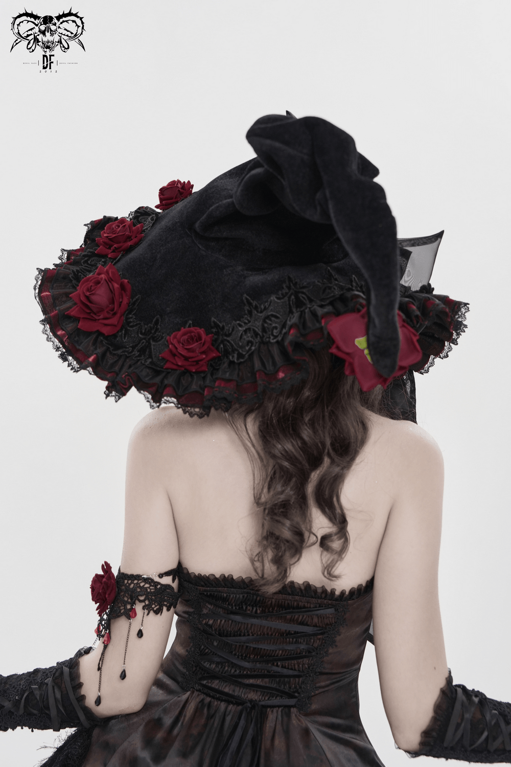 Goth Witch Hat with Roses and Sheer Ribbon Trim for Women worn from behind, showcasing floral trim and wide brim.