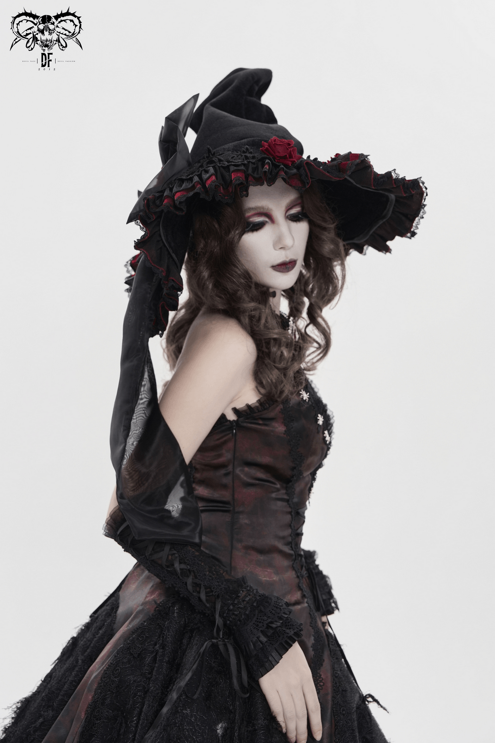 Goth Witch Hat with Roses and Sheer Ribbon Trim for Women worn by a model, showcasing its dark romantic design.