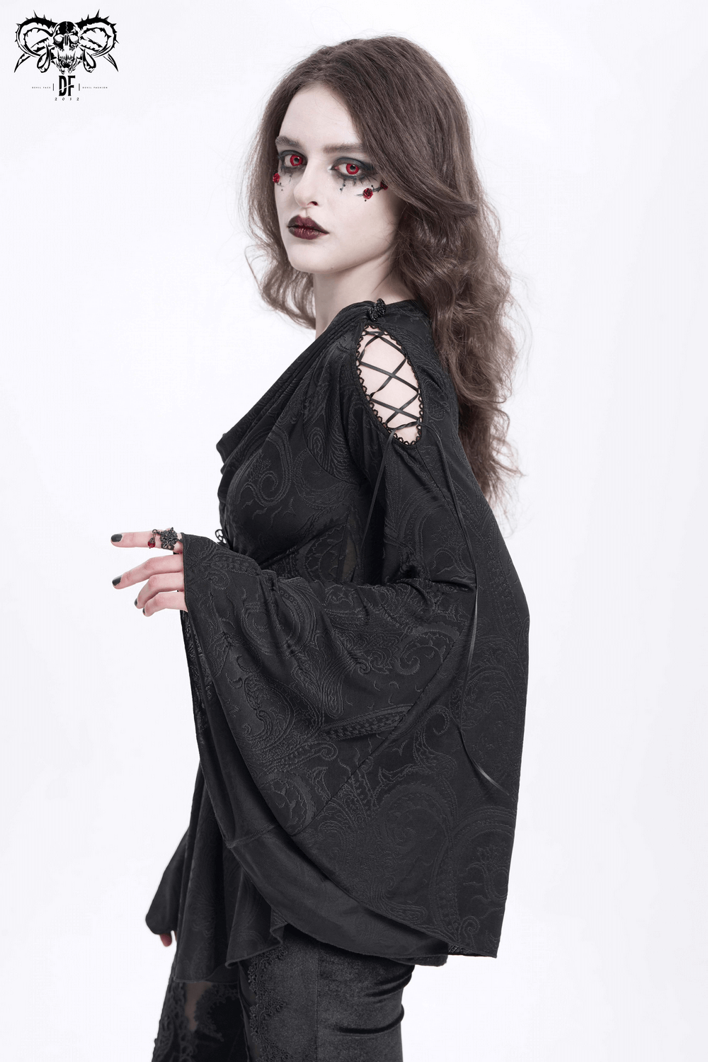 Goth women's top with flared sleeves, lace-up details, and paisley pattern in a dramatic black design.