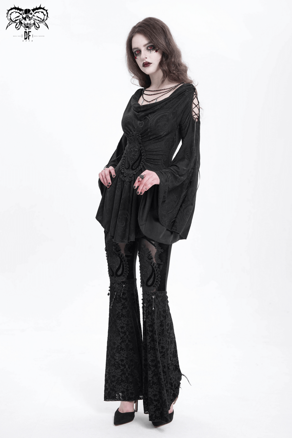 Goth women's top with flared sleeves, lace-up detail, paired with lace pants for dark elegance.