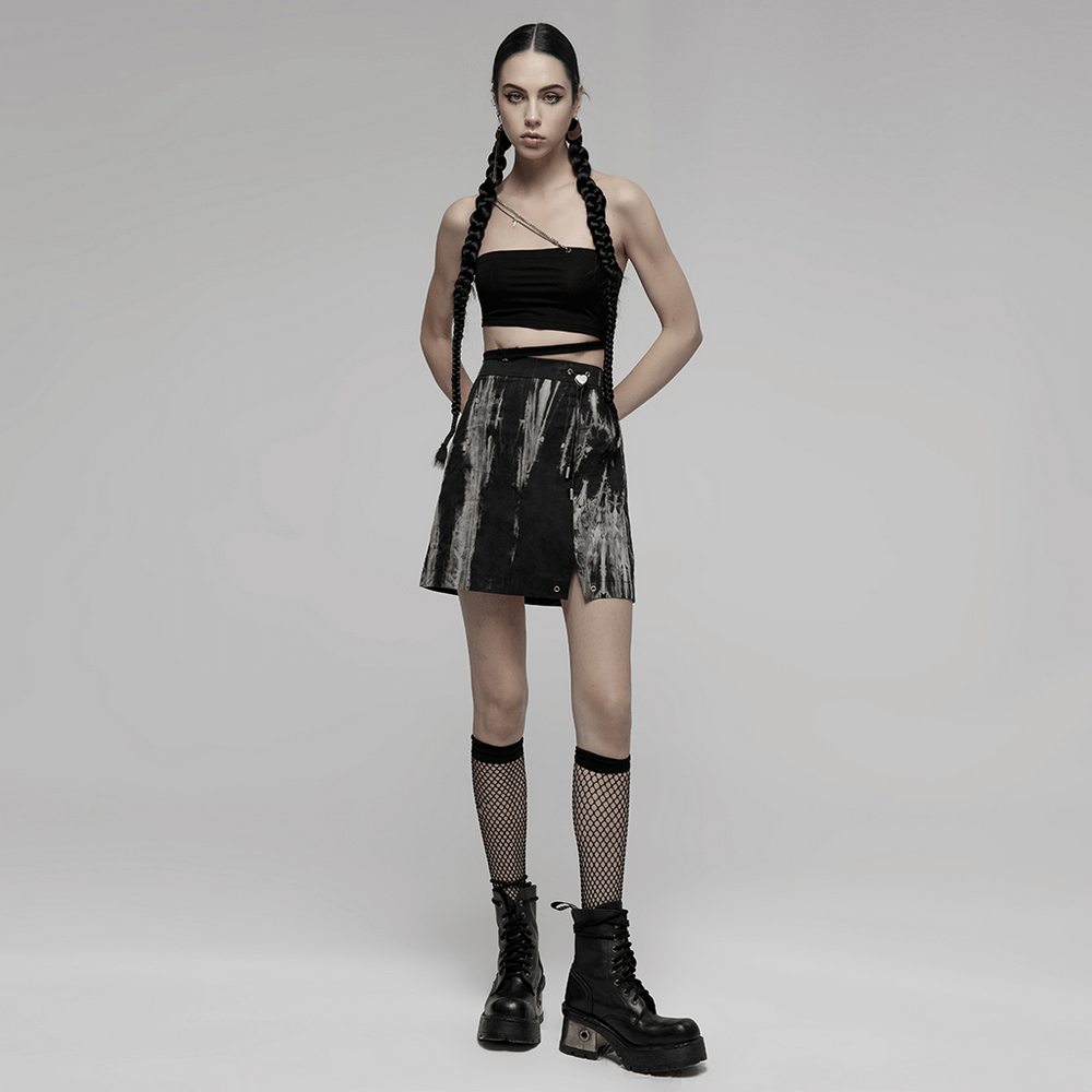 Chic Gothic A-Line skirt with side slit, paired with a black cropped top and fishnet socks for a bold fashion look.