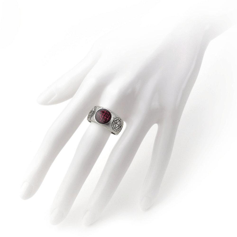 Gothic Agla Ring on a hand, featuring mystical pewter band and red enamel, engraved with Kabbalistic sigils.