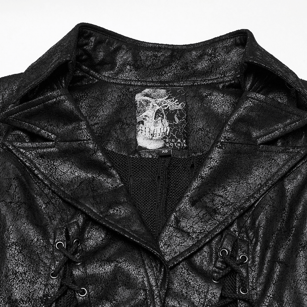 Close-up of the Gothic Alien asymmetric cape showcasing cracked leather and lace-up details.