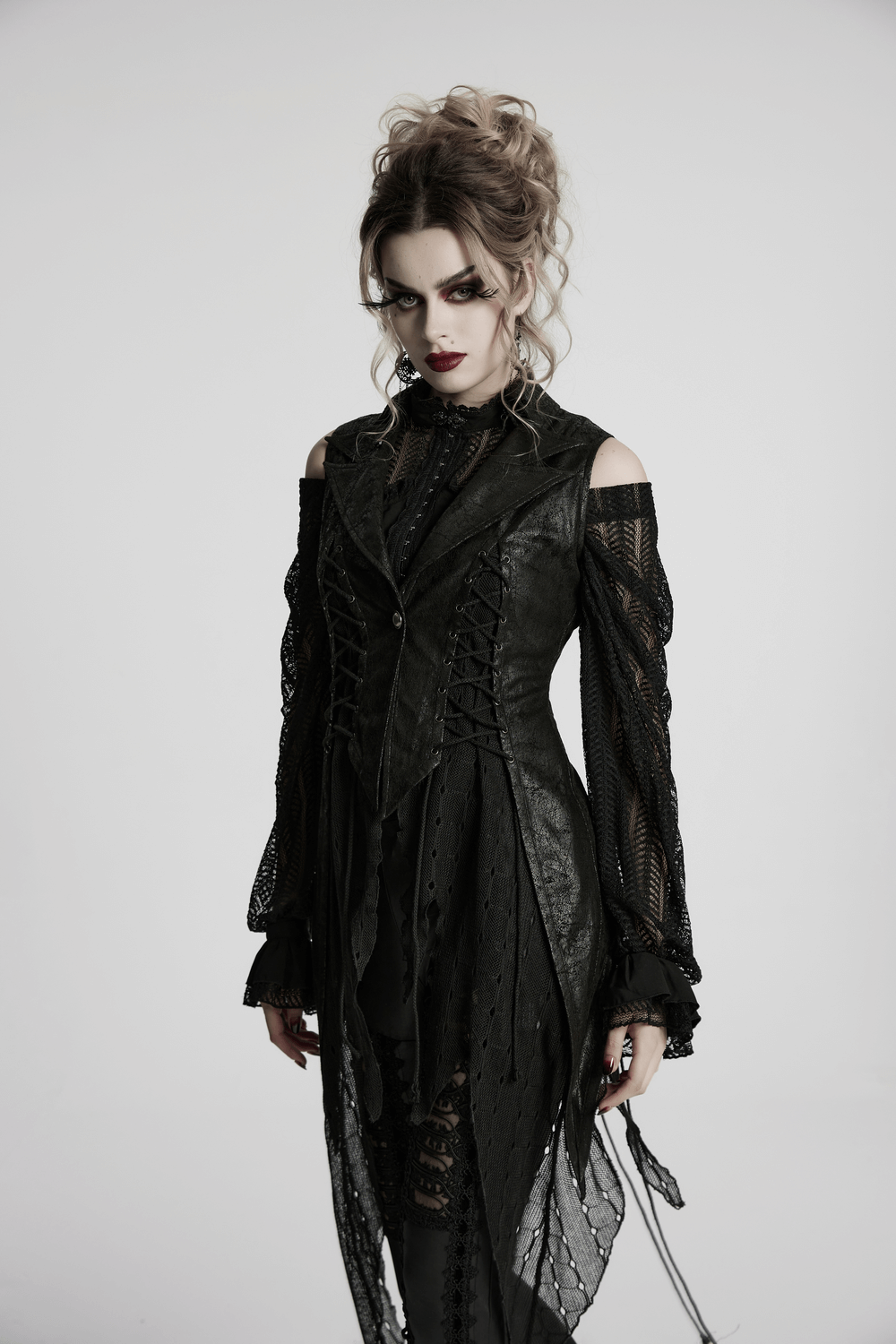Gothic alien asymmetric cape with lace-up design and mesh, showcasing a bold dark fashion statement.