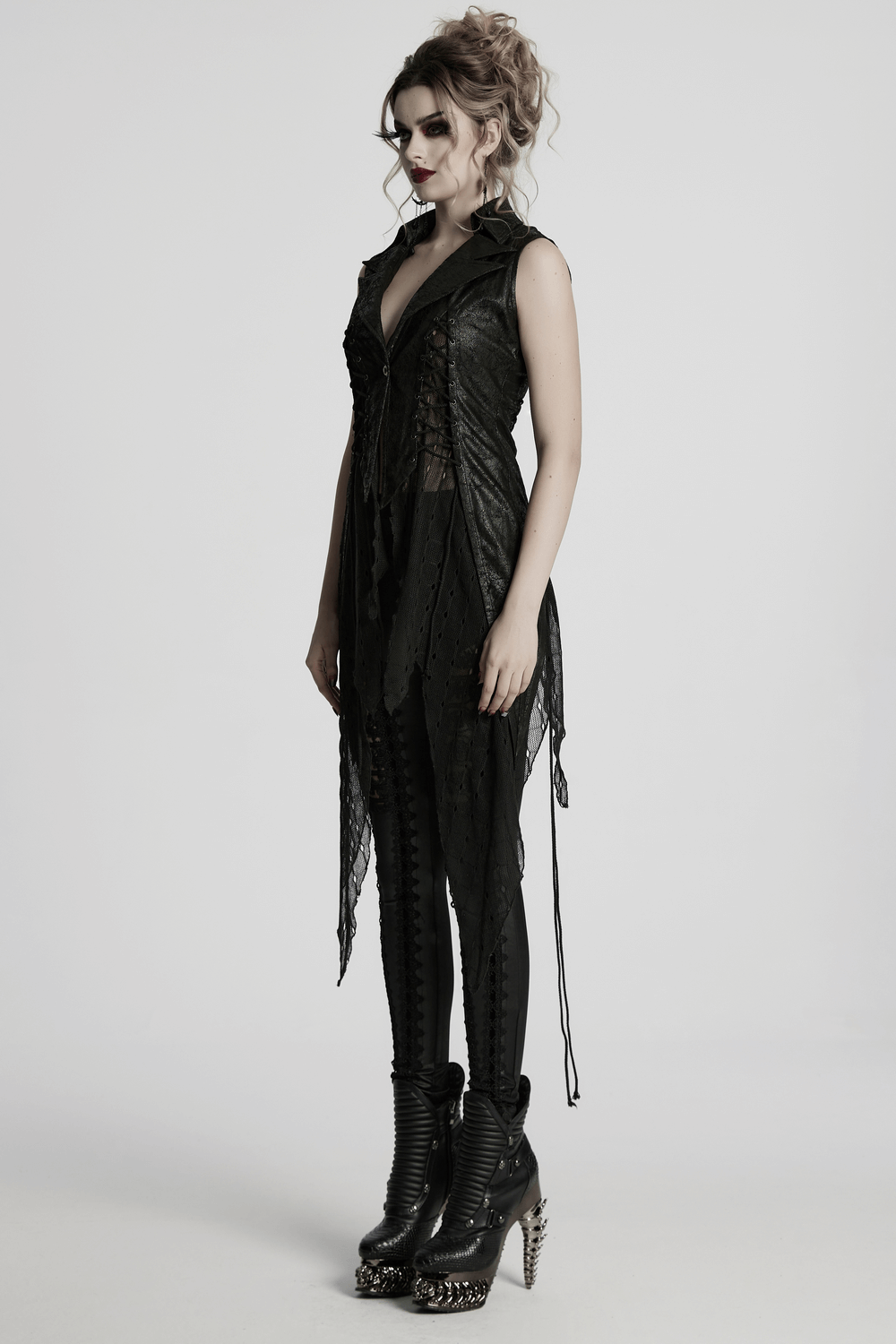 Gothic Alien asymmetrical cape with lace-up design, cracked leather, and mesh detail in dark fashion style.