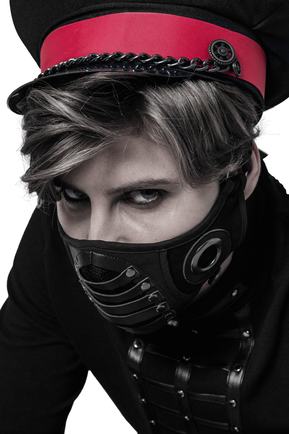 Gothic punk model wearing a black adjustable leather mask and red hat, showcasing innovative alternative fashion style.