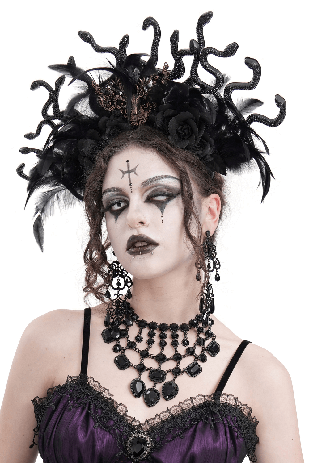 Gothic Medusa-inspired black feathered headpiece with antlers, roses, and snakes for dark fantasy fashion.