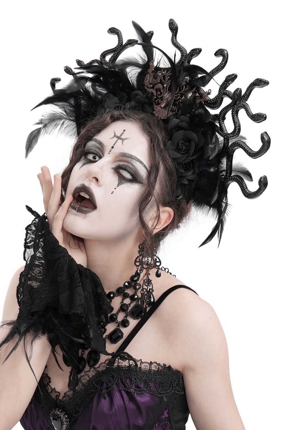 Gothic antler and snake black feathered headpiece worn by model, exuding dark fantasy elegance with roses and dramatic makeup.