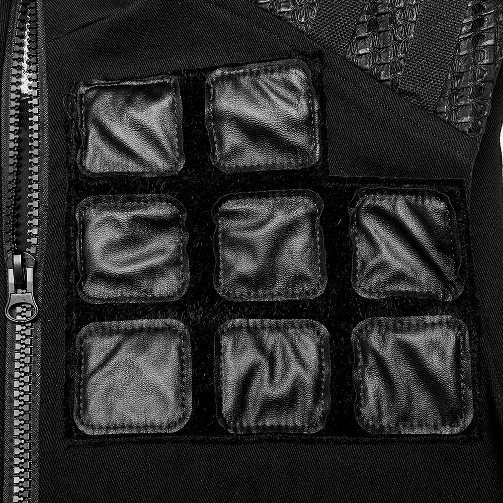 Close-up of Gothic armor vest featuring unique black geometric patch design and sturdy zipper details.