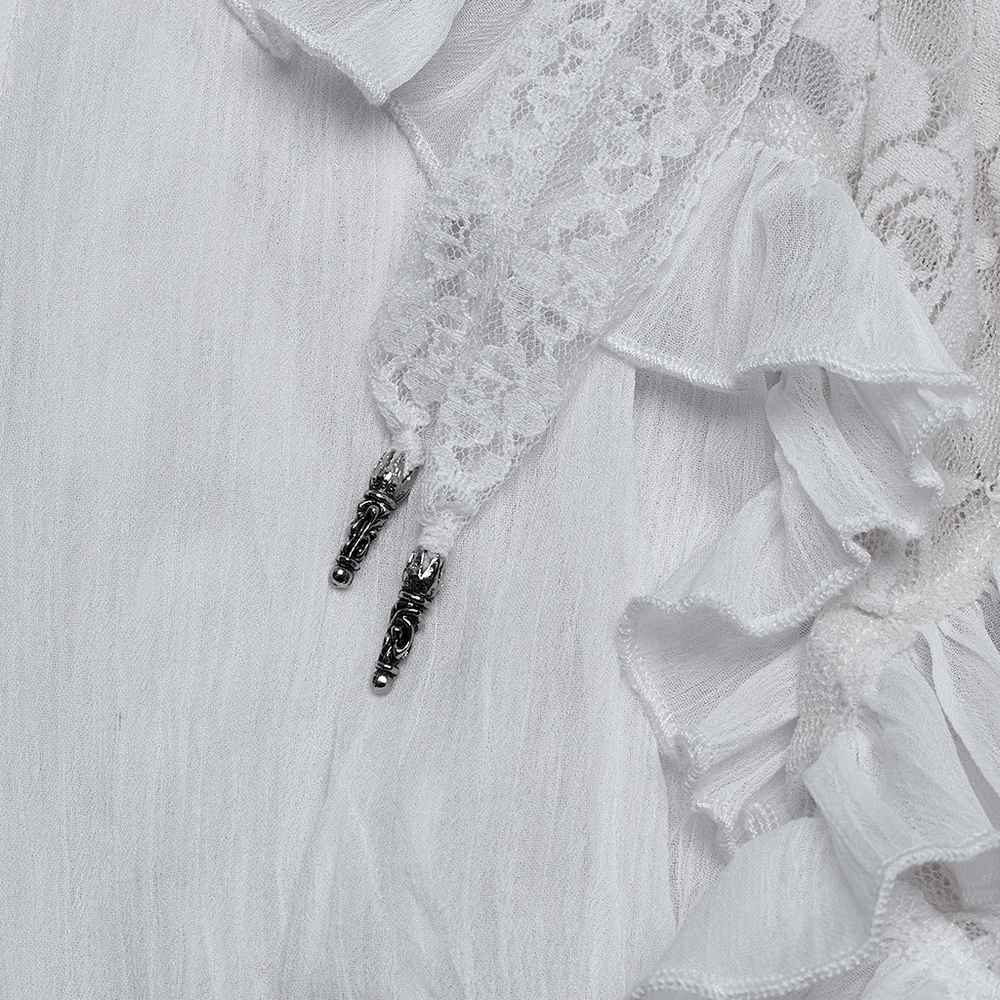 Close-up of lace and drawstrings on a gothic asymmetric white chiffon skirt, featuring ruffles and metal clock detail.