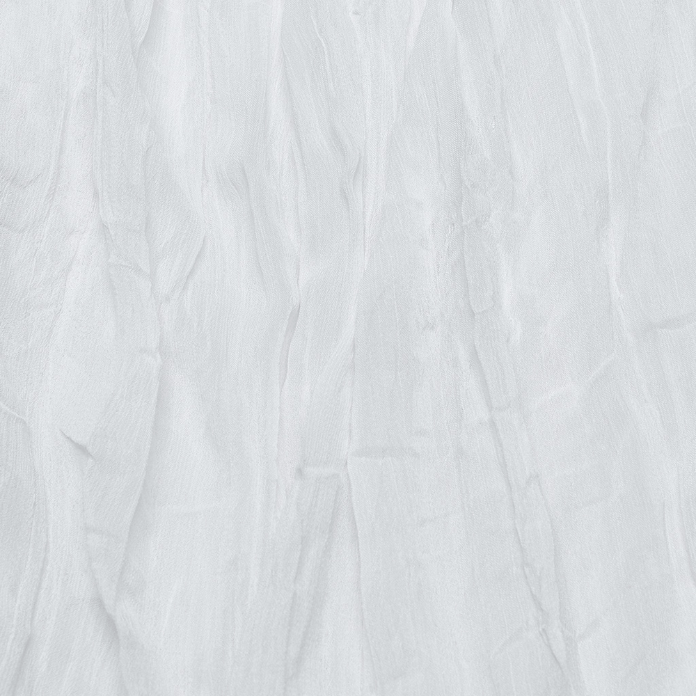 Textured close-up of delicate white chiffon fabric, showcasing elegant wrinkles and soft, flowing quality.