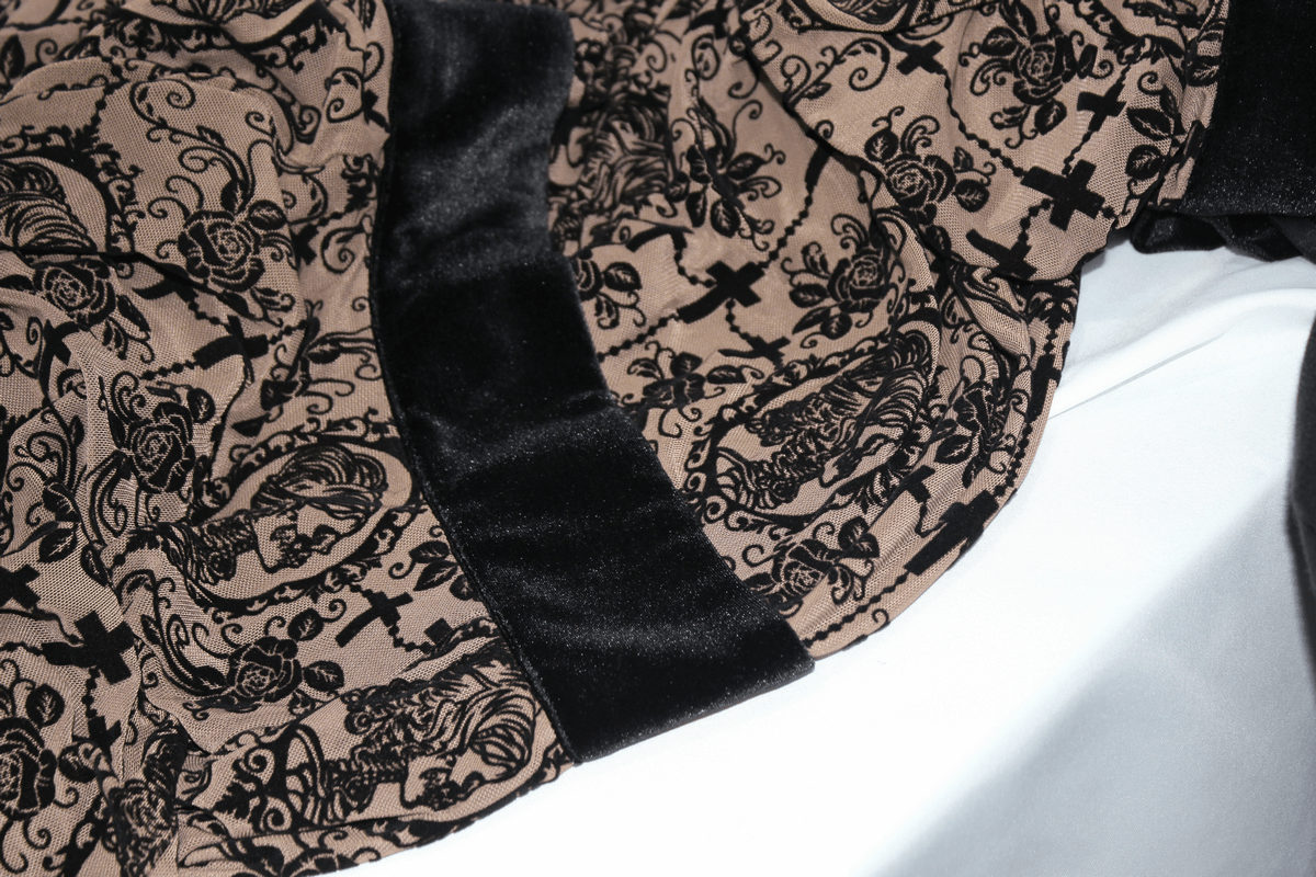 Close-up of gothic lace fabric featuring intricate black patterns on a beige background for stylish black dress design.