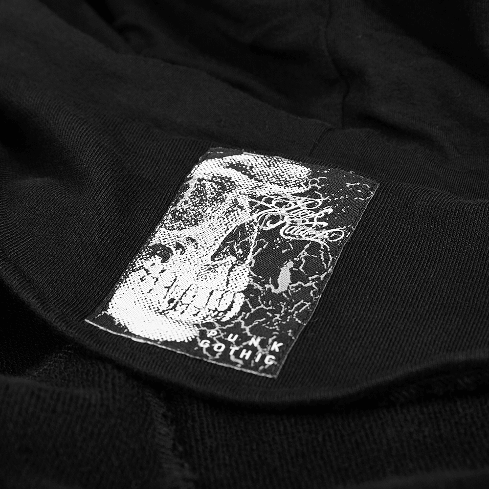 Close-up of the gothic skull label on the hooded coat from the Darkly Series Punk collection.