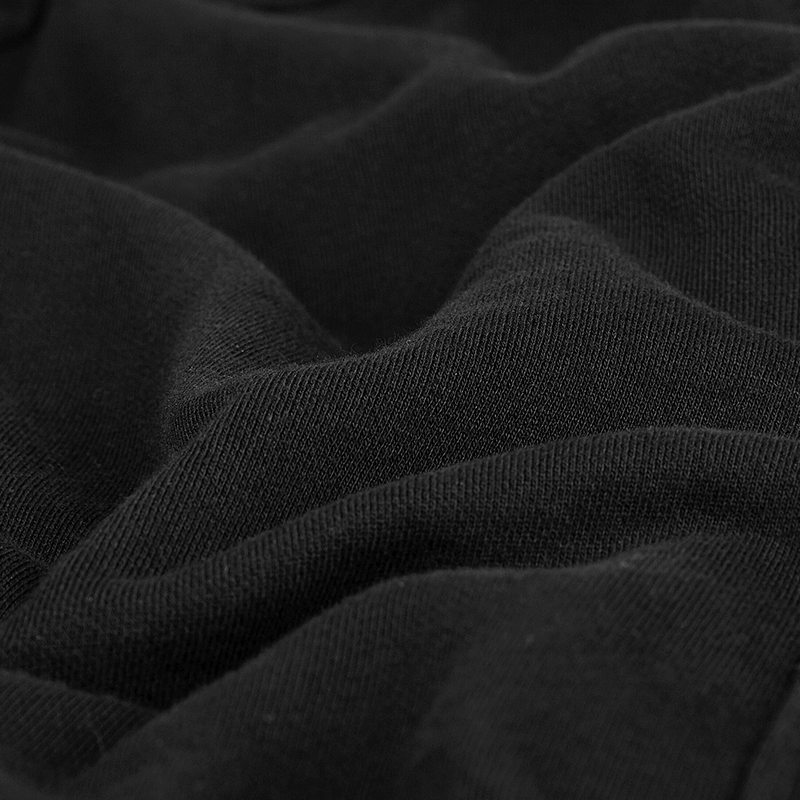 Close-up of soft black fleece fabric, showcasing unique texture and layering potential for gothic fashion.