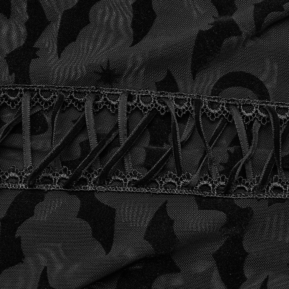 Close-up of gothic bat mesh fabric featuring intricate lace trim and bat designs, perfect for dark fashion enthusiasts.